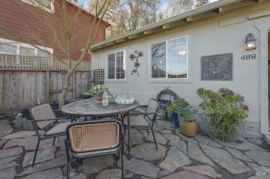 486 South Main Street Sebastopol, CA 95472 - Photo 16 of 27 a view of a patio with table and chairs and potted plants
