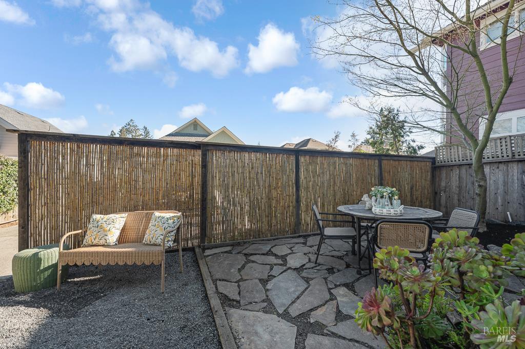 486 South Main Street Sebastopol, CA 95472 - Photo 20 of 27 a backyard of a house with dining table and chairs