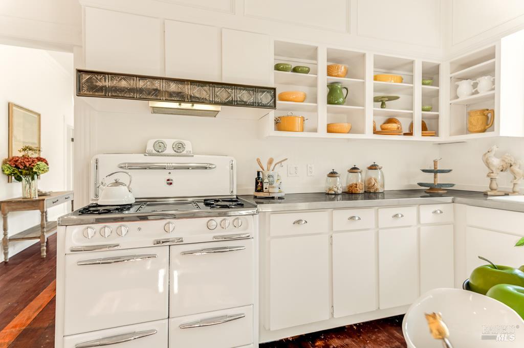 486 South Main Street Sebastopol, CA 95472 - Photo 10 of 27 a kitchen with granite countertop white cabinets and white appliances
