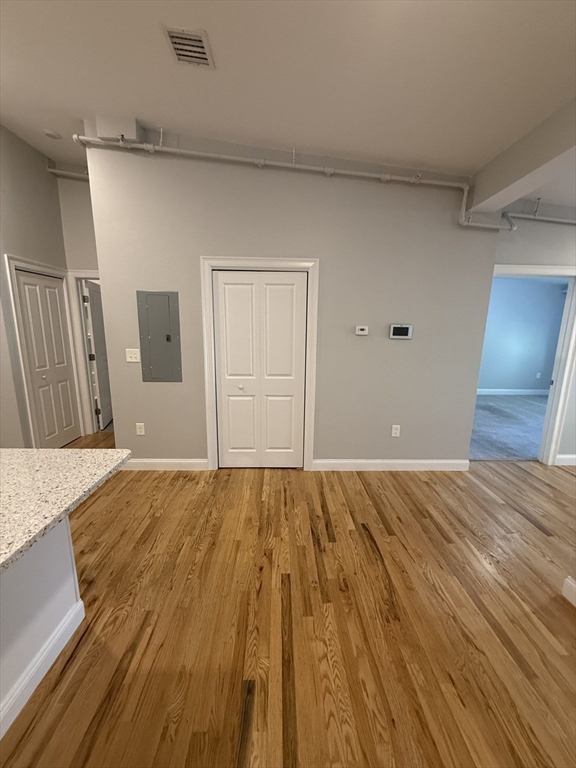 20 Locust Street, Unit 311 Danvers, MA 01923 - Photo 4 of 13 a view of a livingroom with wooden floor
