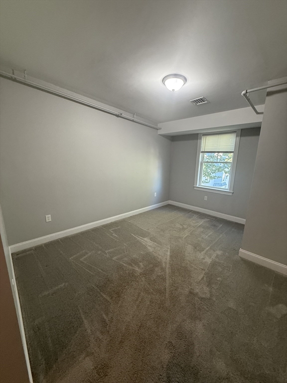 20 Locust Street, Unit 311 Danvers, MA 01923 - Photo 9 of 13 an empty room with windows