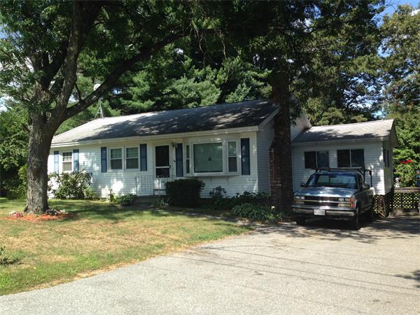31 A George Brown Street Billerica, MA 01821 - Photo 1 of 8 a front view of a house with a yard