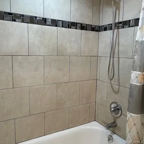 a bathroom with a sink and a shower