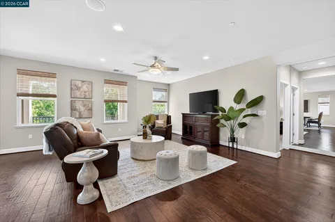 a living room with furniture rug and window