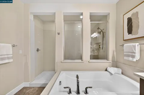 a bathroom with a tub and a sink