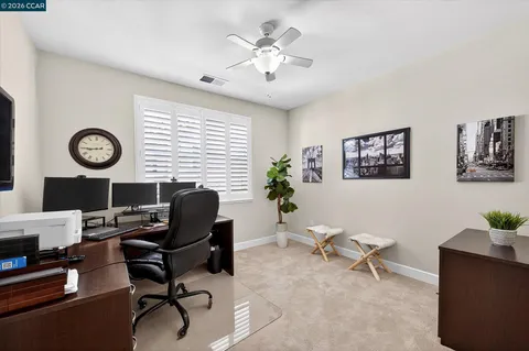 a work room with furniture and a window