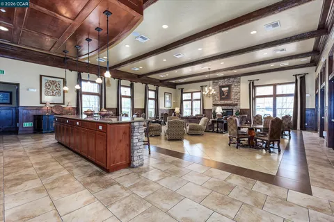 a living room with lots of furniture and painting on the wall