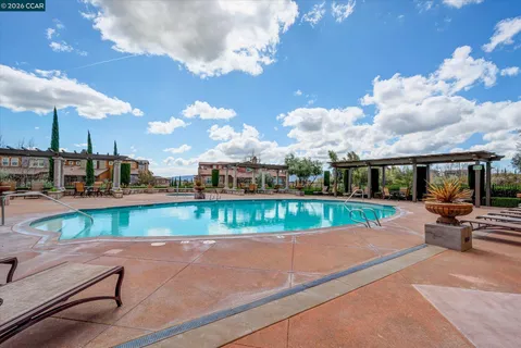 a view of a swimming pool with a patio