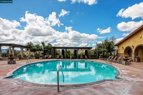 a view of a swimming pool with a patio