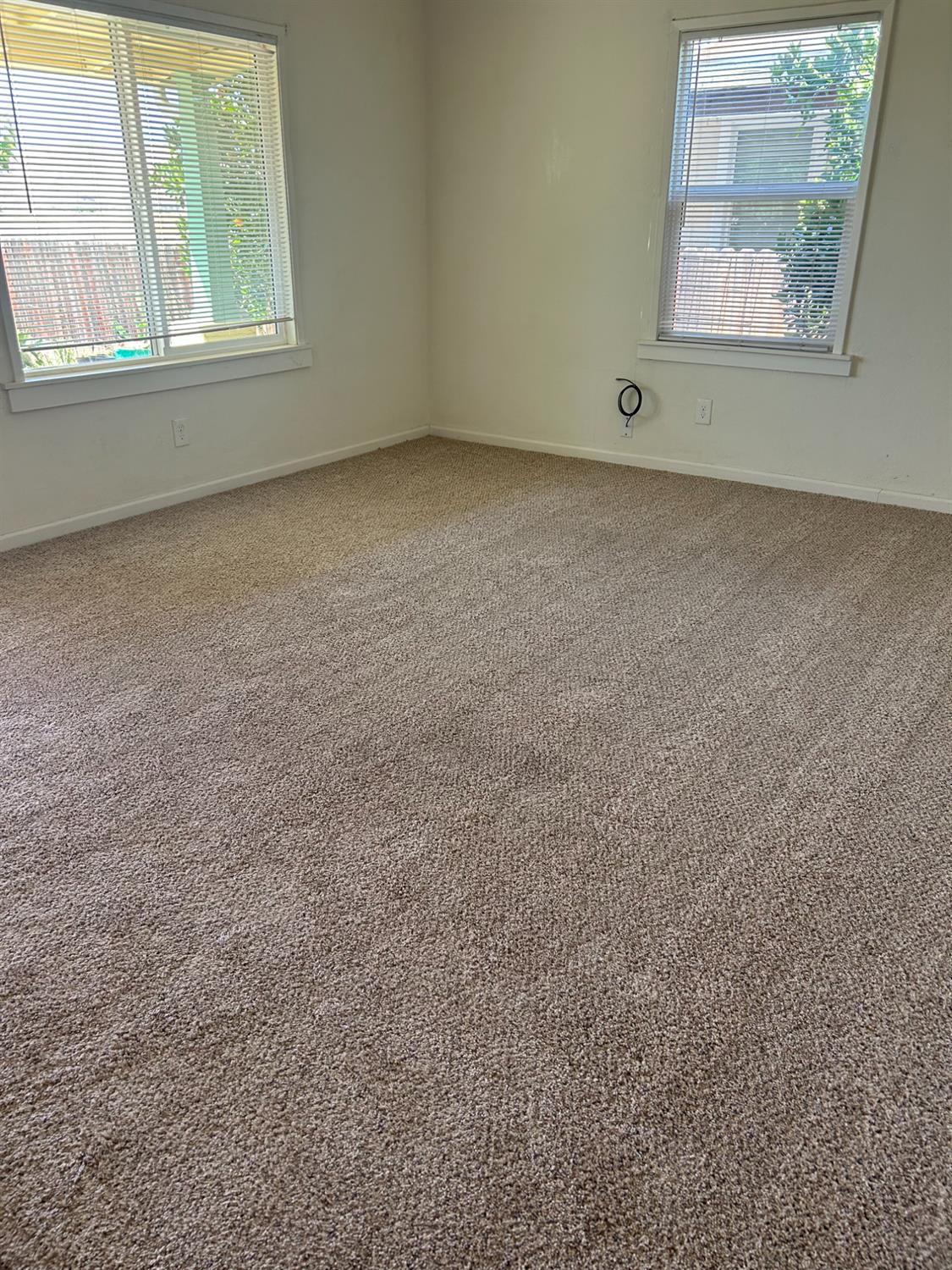 313 East Sacramento Street Coalinga, CA 93210 - Photo 7 of 23 an empty room with a window