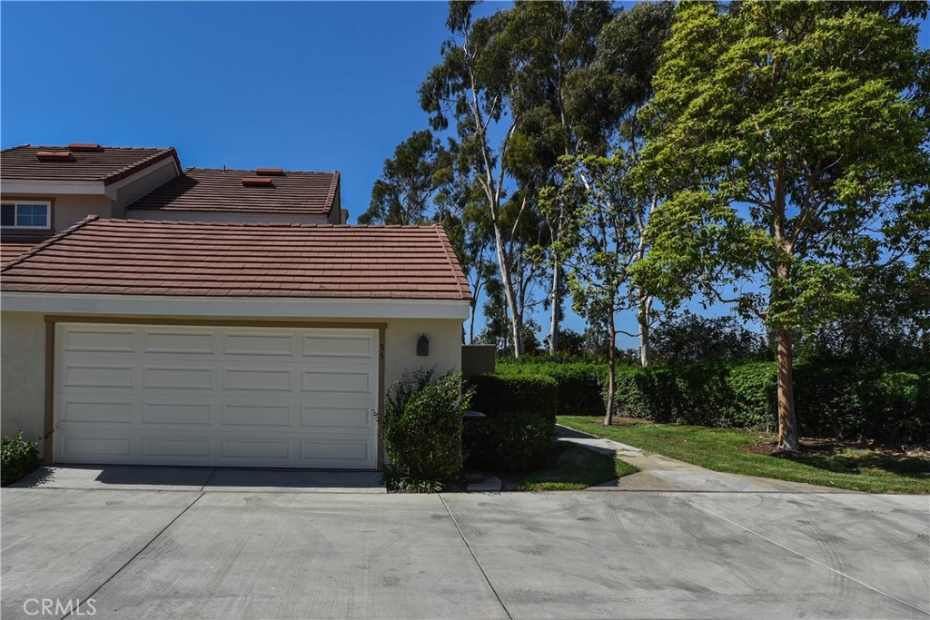 55 Wellesley, Unit 55 Irvine, CA 92612 - Photo 10 of 11 a view of backyard with plants and trees