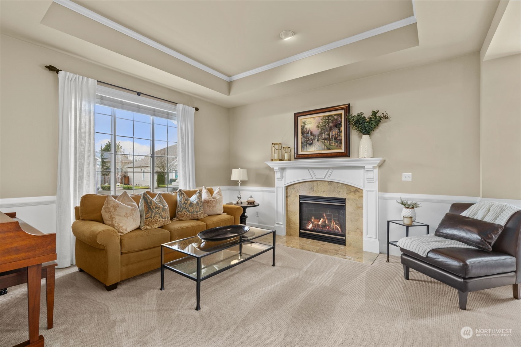 20828 37th Avenue Southeast Bothell, WA 98021 - Photo 11 of 38 a living room with furniture and a fireplace