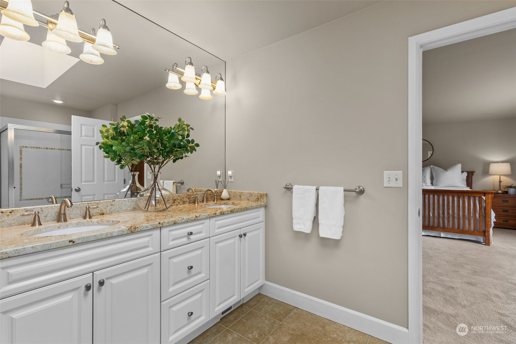 20828 37th Avenue Southeast Bothell, WA 98021 - Photo 19 of 38 a bathroom with a sink a mirror and a light fixture
