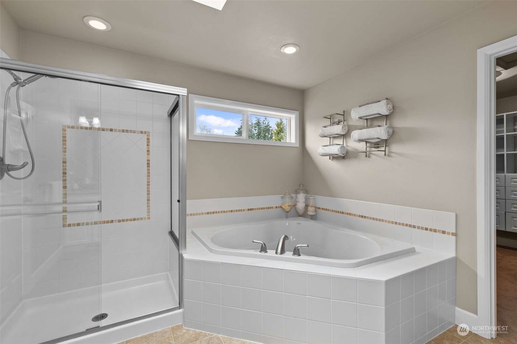 20828 37th Avenue Southeast Bothell, WA 98021 - Photo 20 of 38 a white bath tub sitting next to a bathroom sink