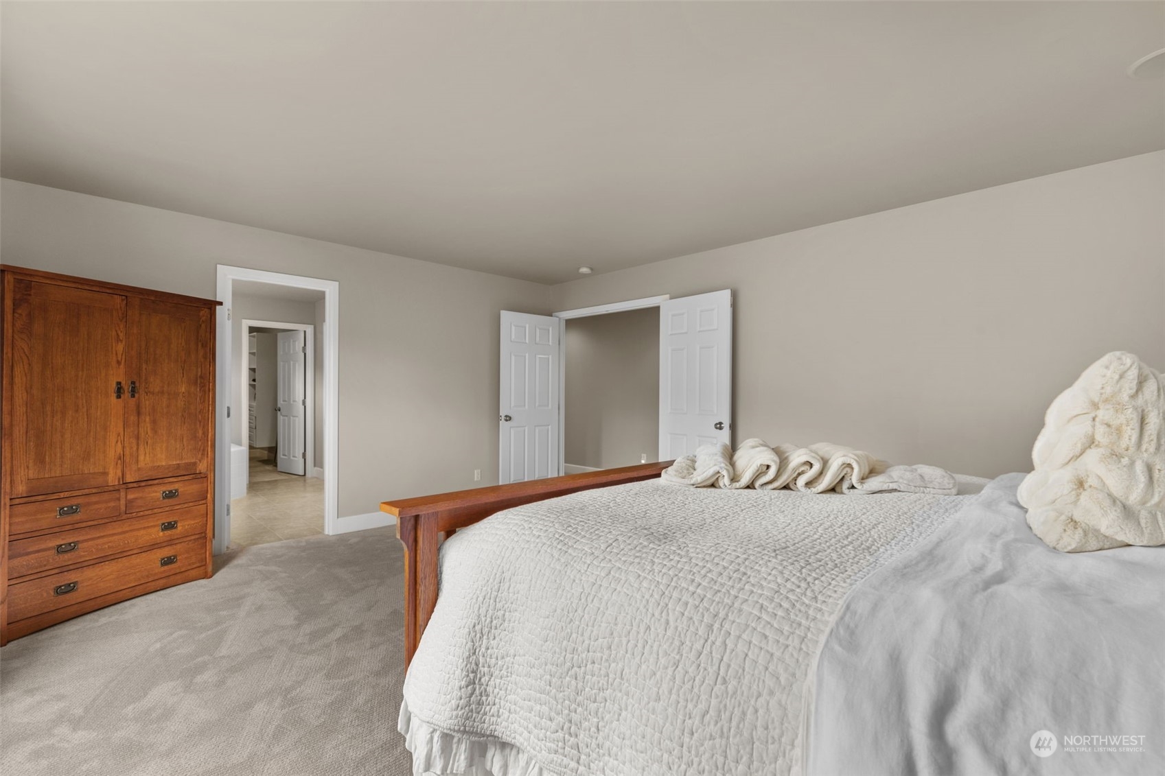 20828 37th Avenue Southeast Bothell, WA 98021 - Photo 22 of 38 a bedroom with a bed and a dresser