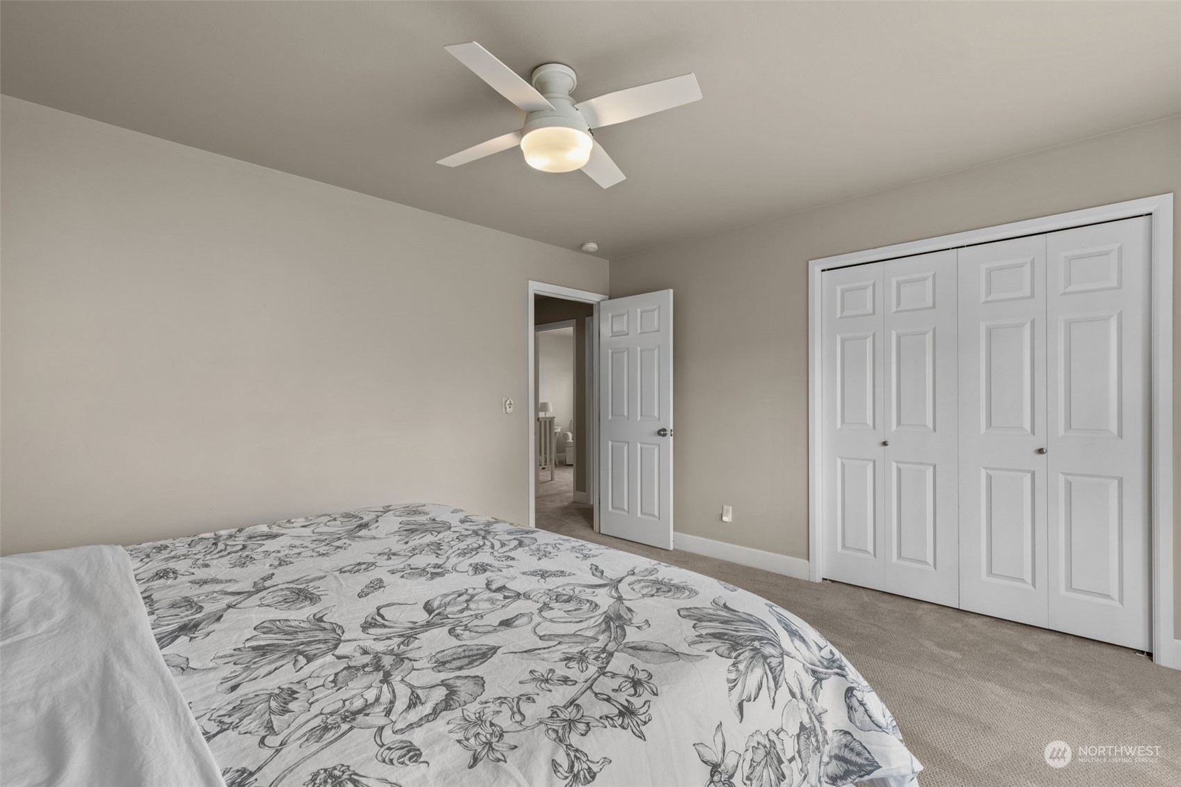 20828 37th Avenue Southeast Bothell, WA 98021 - Photo 26 of 38 a bedroom with a large bed and a chandelier