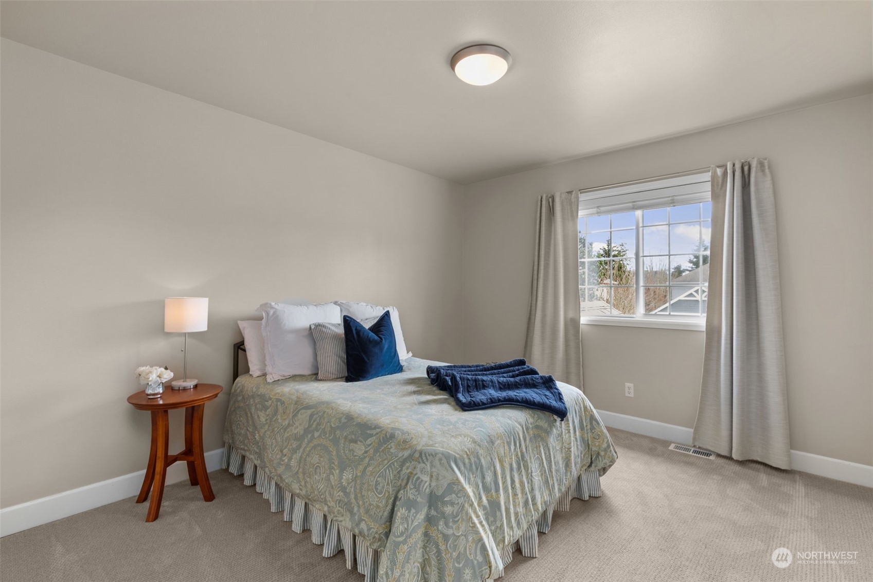 20828 37th Avenue Southeast Bothell, WA 98021 - Photo 27 of 38 a bedroom with a bed and a window
