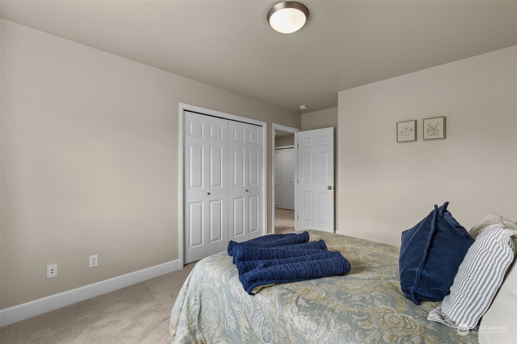 20828 37th Avenue Southeast Bothell, WA 98021 - Photo 28 of 38 a spacious bedroom with a bed and a chair