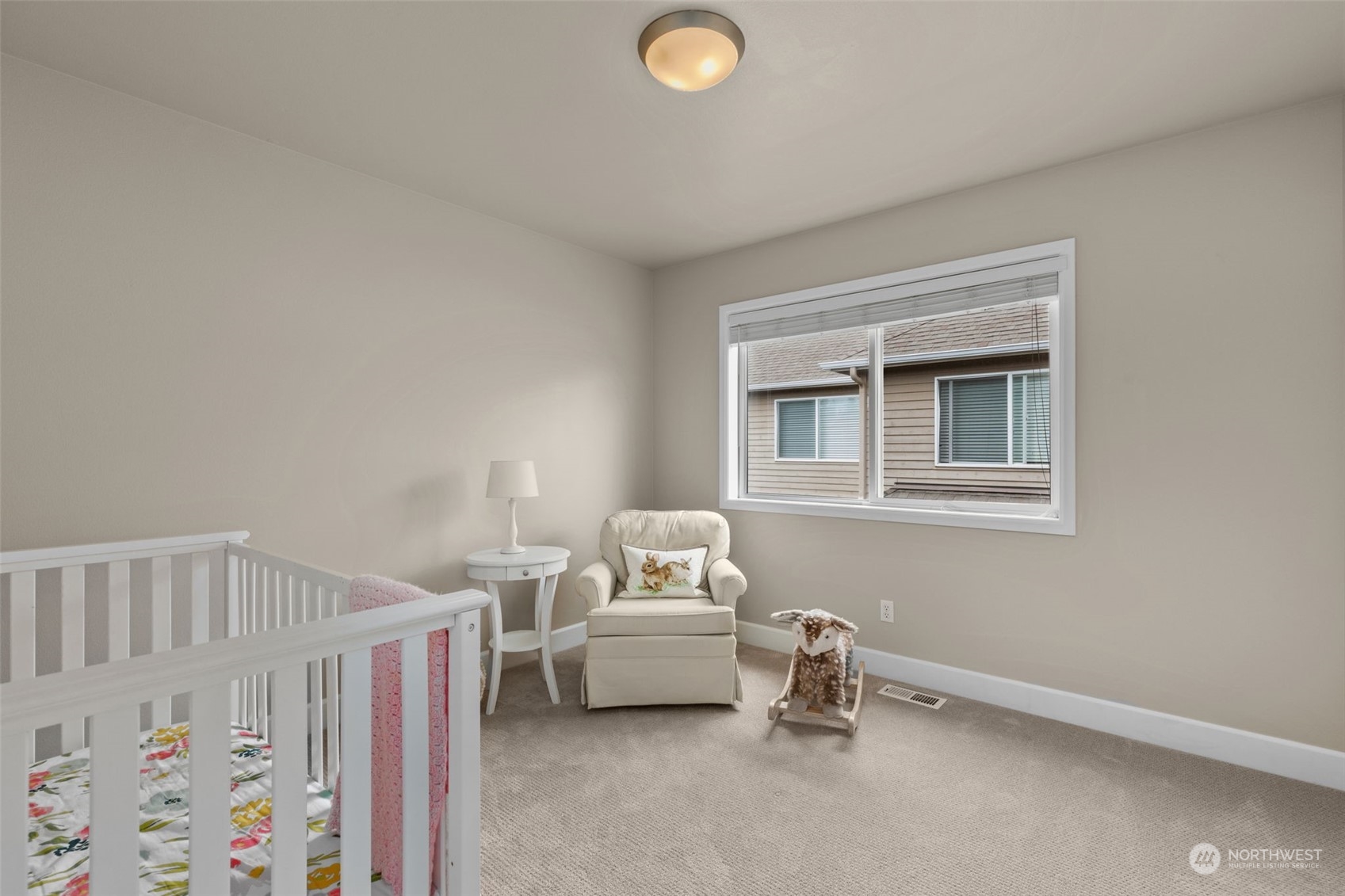 20828 37th Avenue Southeast Bothell, WA 98021 - Photo 29 of 38 a bedroom with a bed and a window