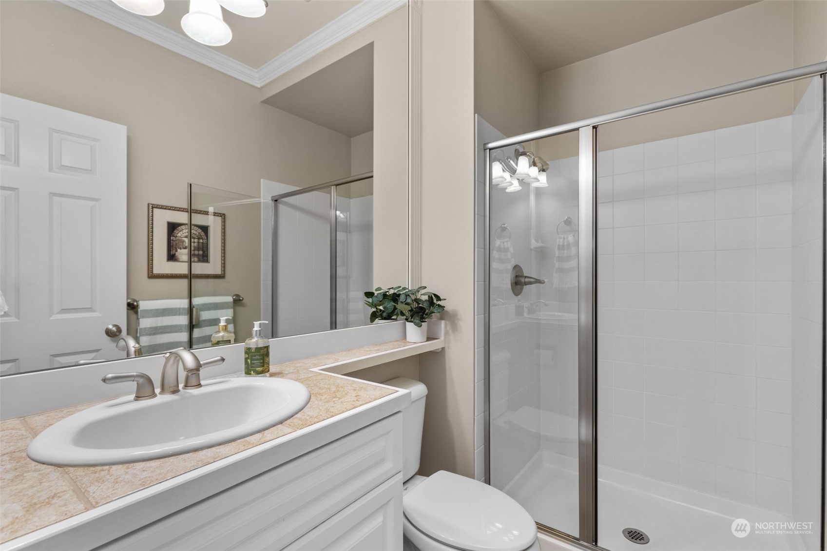 20828 37th Avenue Southeast Bothell, WA 98021 - Photo 31 of 38 a bathroom with a sink toilet and shower