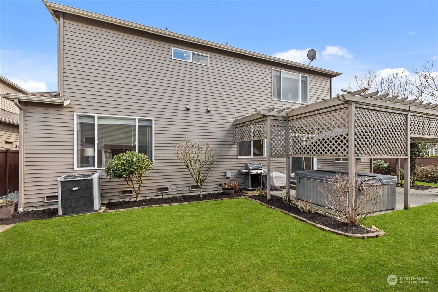 20828 37th Avenue Southeast Bothell, WA 98021 - Photo 34 of 38 a view of a house with a yard and furniture