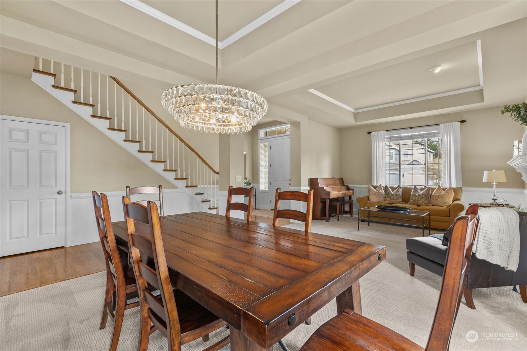 20828 37th Avenue Southeast Bothell, WA 98021 - Photo 10 of 38 a dining room with furniture a chandelier and wooden floor