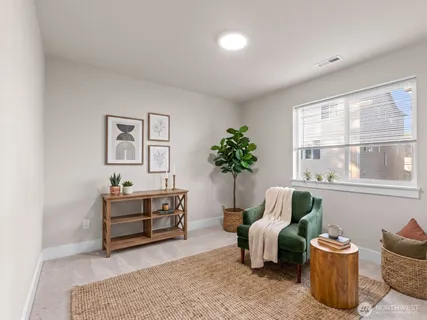 a living room with furniture and window