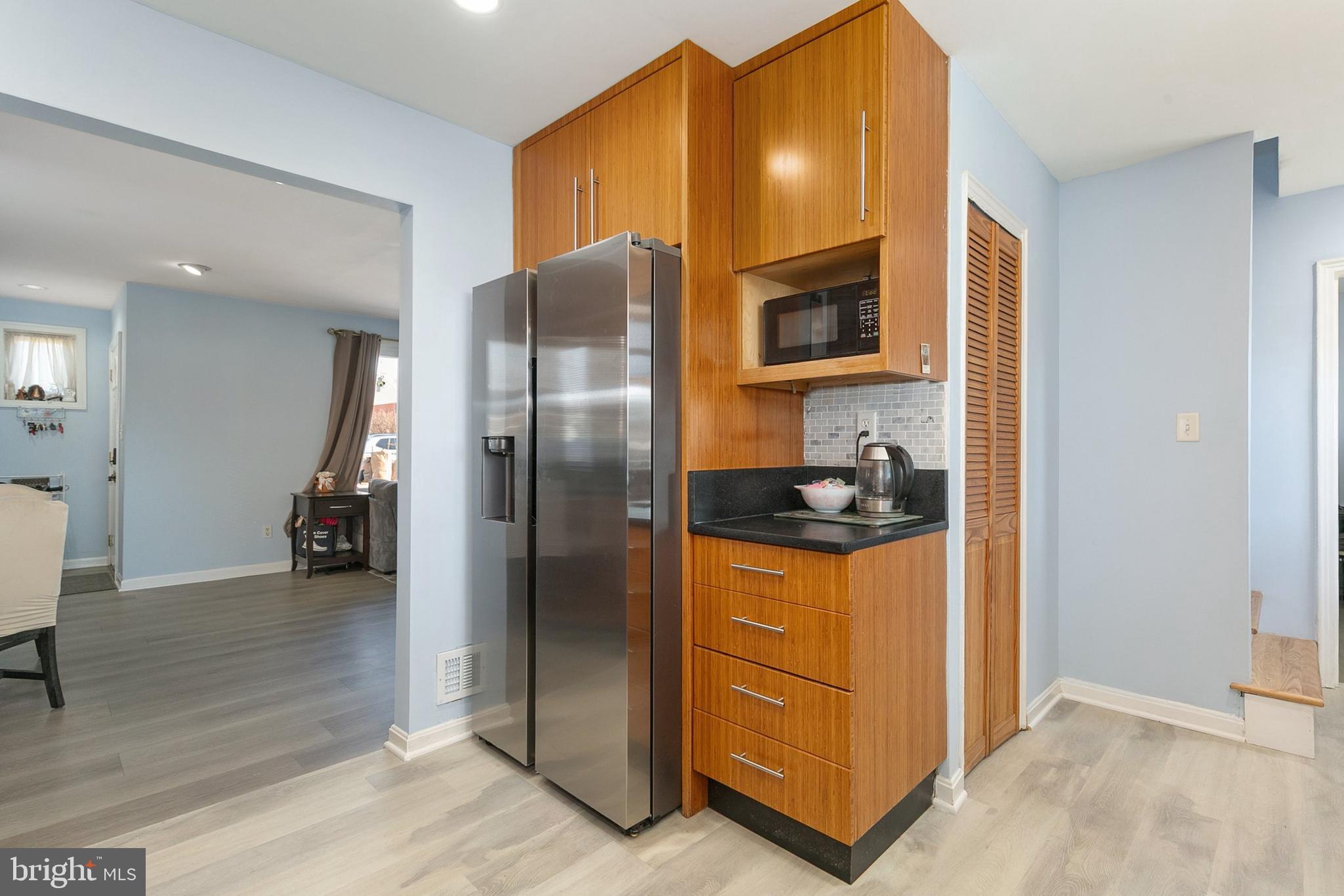 9632 Cottrell Terrace Silver Spring, MD 20903 - Photo 12 of 36 a kitchen with stainless steel appliances granite countertop a refrigerator and a stove
