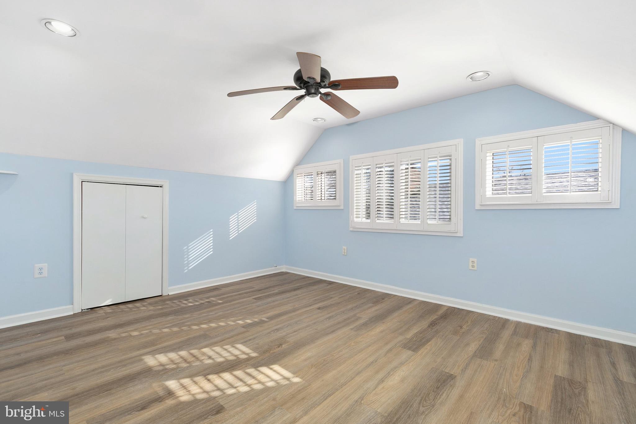 9632 Cottrell Terrace Silver Spring, MD 20903 - Photo 26 of 36 a view of empty room with wooden floor and fan