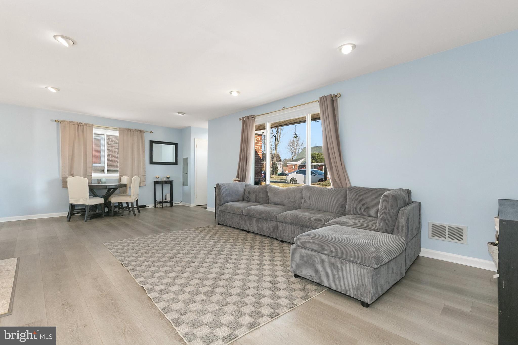 9632 Cottrell Terrace Silver Spring, MD 20903 - Photo 3 of 36 a living room with furniture and a couch