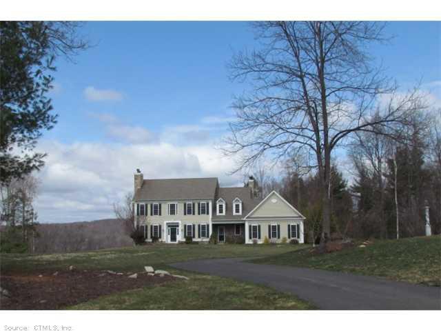84 East Mountain Road Canton, CT 06019 - Photo 1 of 1 a front view of a house with a garden