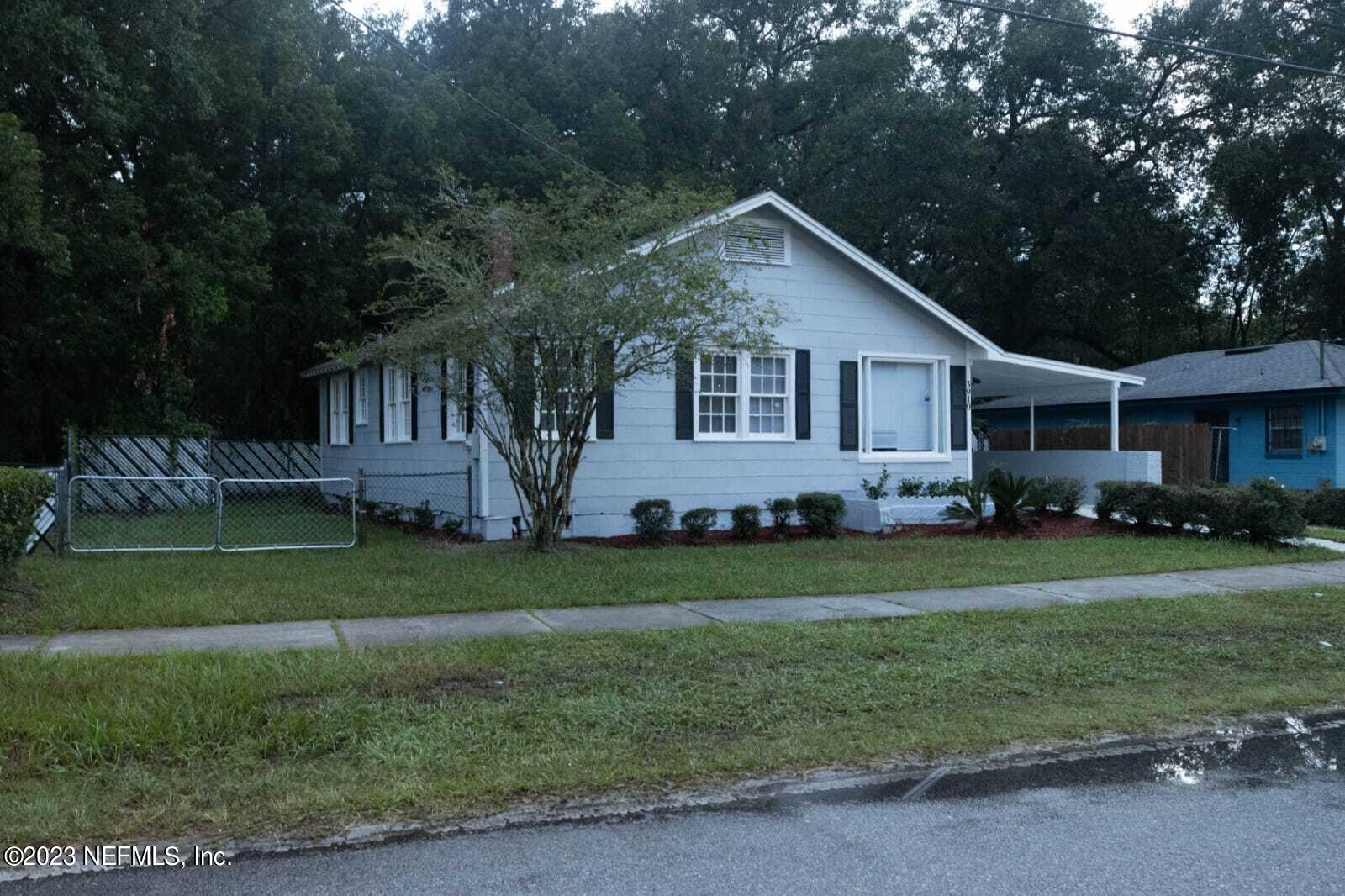 3910 Grant Road Jacksonville, FL 32207 - Photo 2 of 32 a front view of a house with a yard