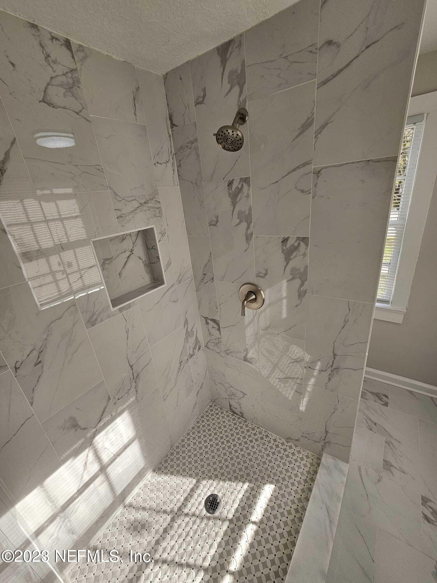 3910 Grant Road Jacksonville, FL 32207 - Photo 27 of 32 a bathroom with a shower