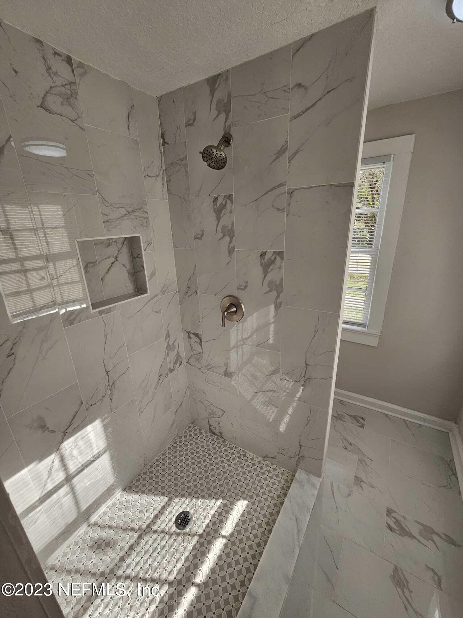 3910 Grant Road Jacksonville, FL 32207 - Photo 29 of 32 a bathroom with a sink toilet and shower