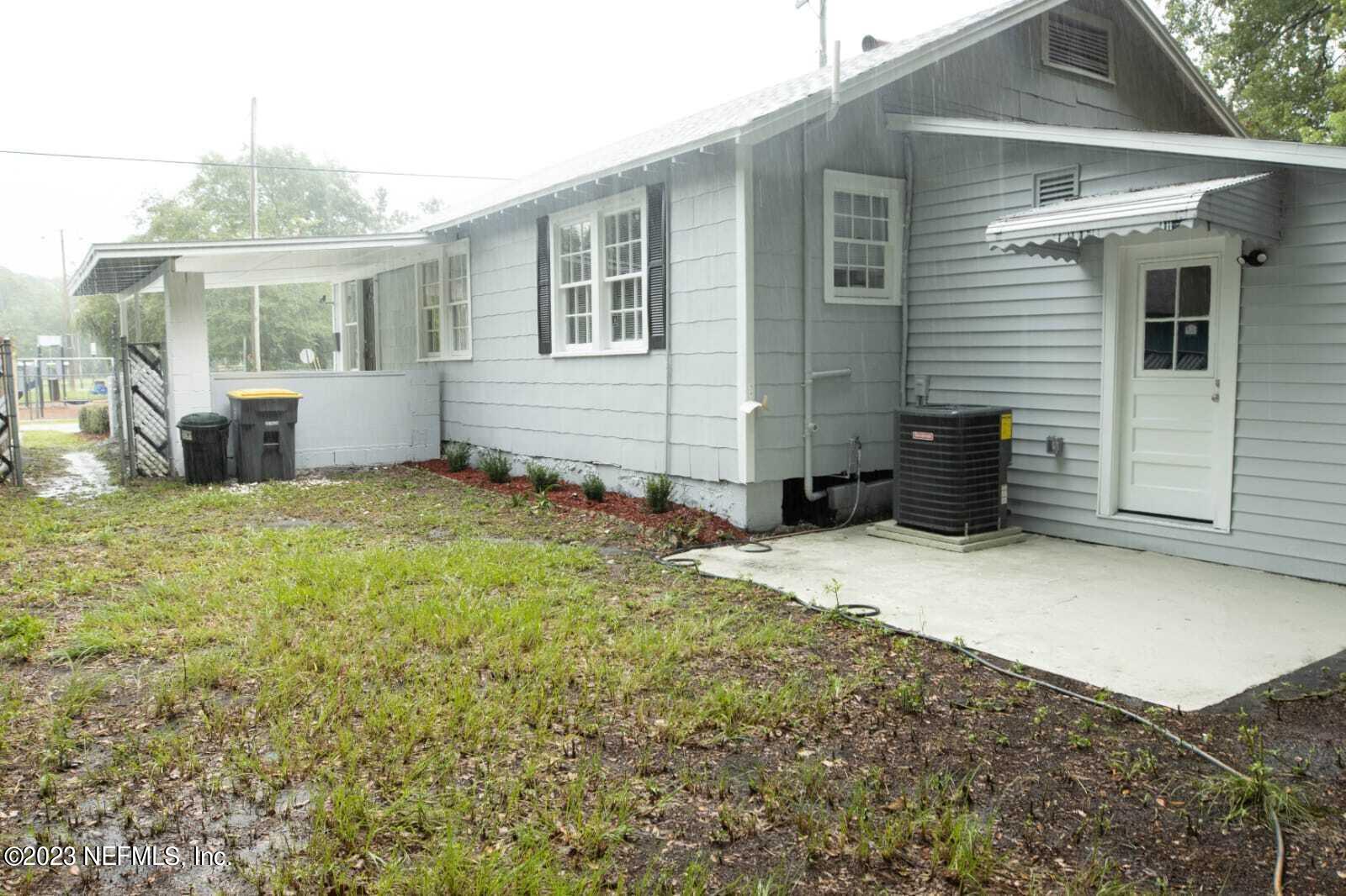 3910 Grant Road Jacksonville, FL 32207 - Photo 32 of 32 a view of a house with backyard and porch