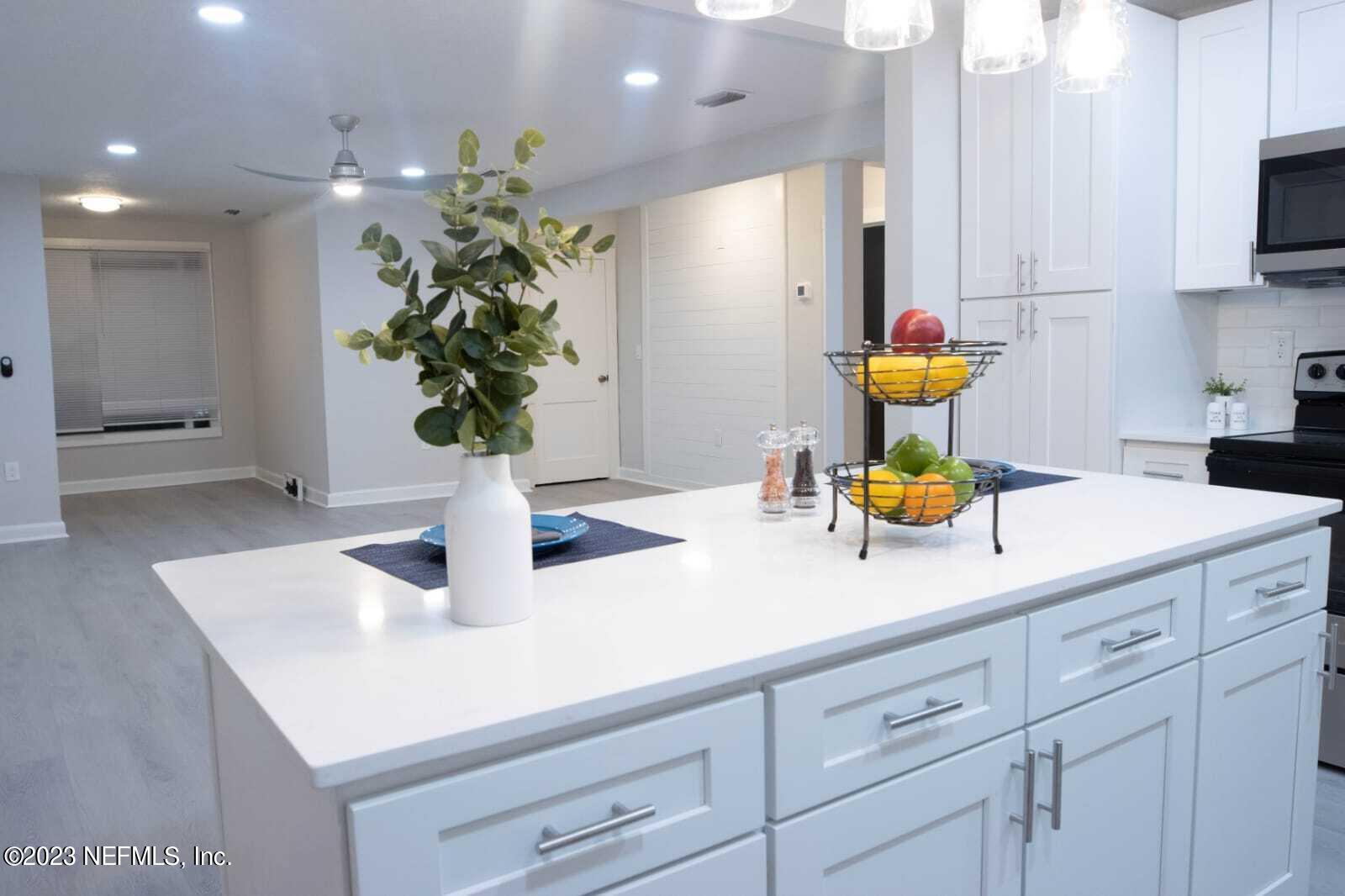 3910 Grant Road Jacksonville, FL 32207 - Photo 5 of 32 a kitchen with a sink and a counter top space