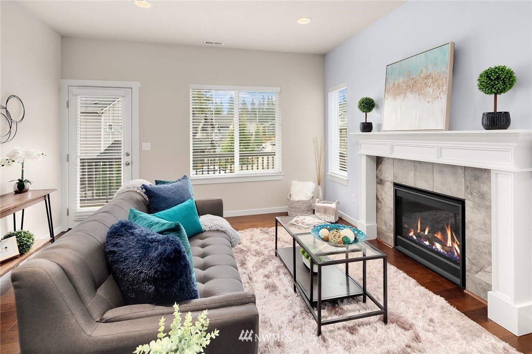 5 157th Lane Southeast Bothell, WA 98012 - Photo 12 of 27 a living room with furniture and a fireplace