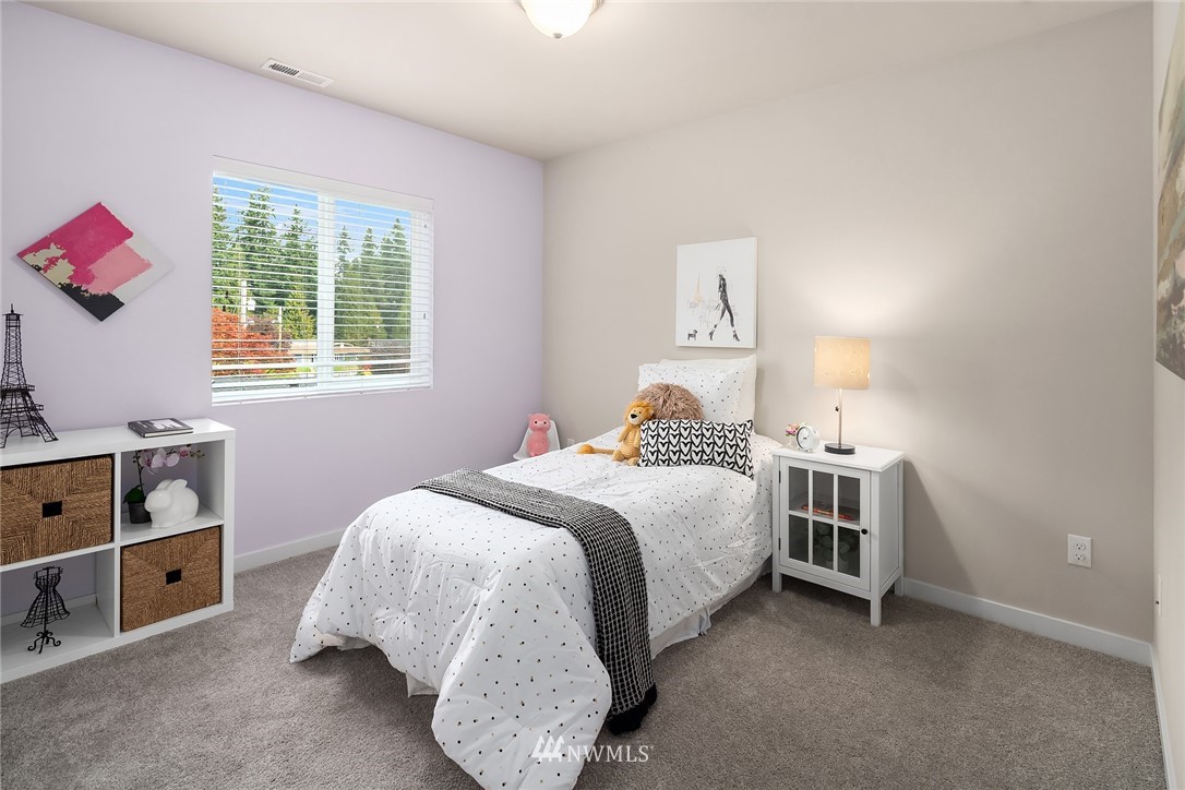 5 157th Lane Southeast Bothell, WA 98012 - Photo 15 of 27 a bedroom with a bed and a window