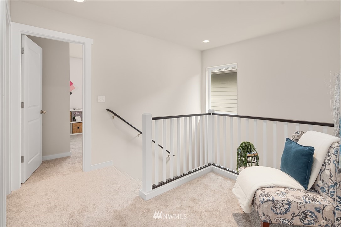5 157th Lane Southeast Bothell, WA 98012 - Photo 17 of 27 a view of a bedroom with wooden floor and stairs