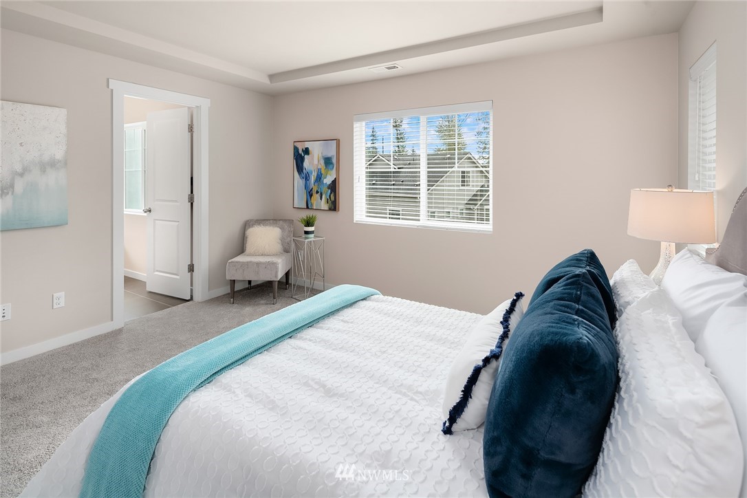 5 157th Lane Southeast Bothell, WA 98012 - Photo 22 of 27 a bedroom with a bed and hallway