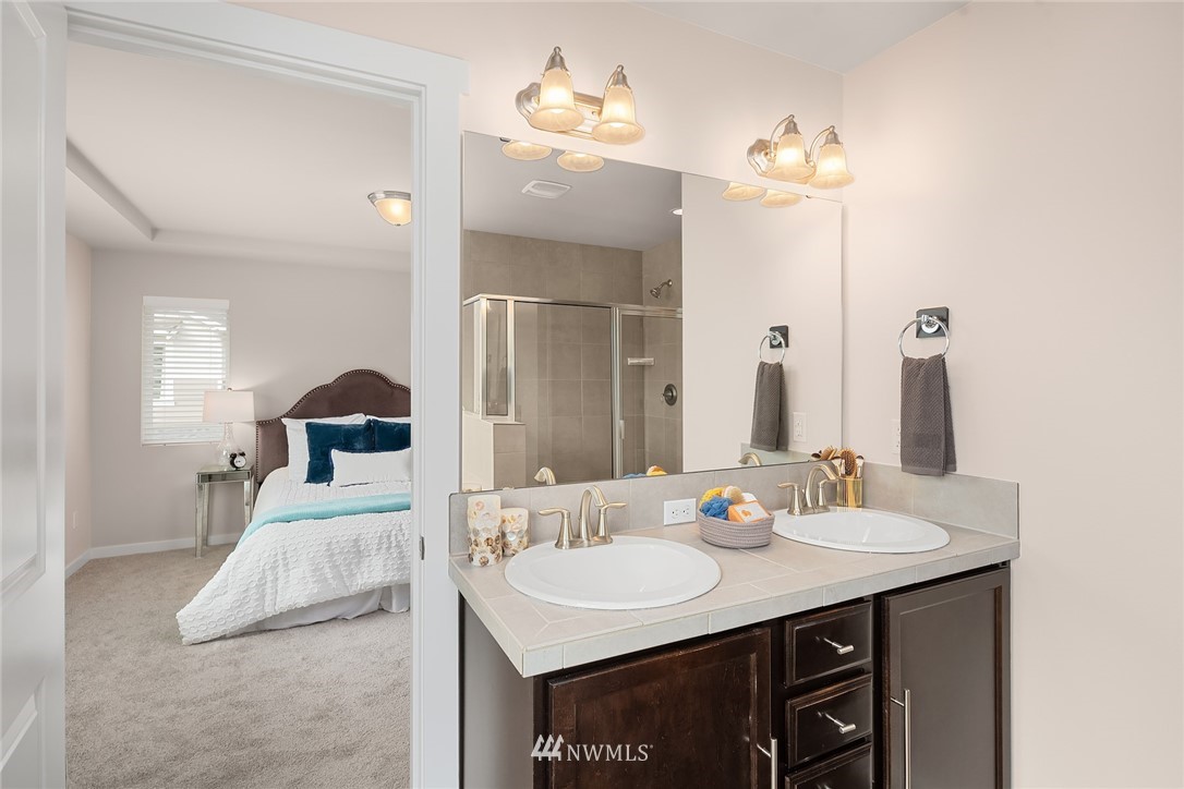 5 157th Lane Southeast Bothell, WA 98012 - Photo 24 of 27 a en suite bathroom with a double vanity sink and a mirror