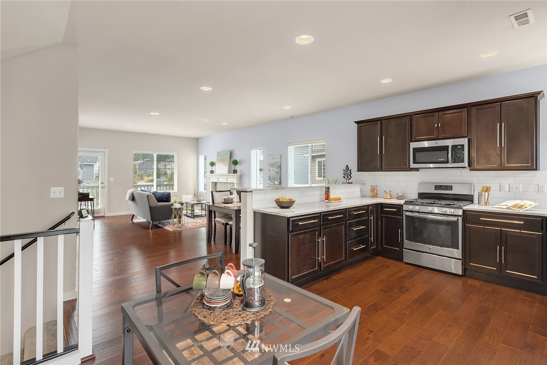 5 157th Lane Southeast Bothell, WA 98012 - Photo 4 of 27 a large kitchen with stainless steel appliances lots of counter top space