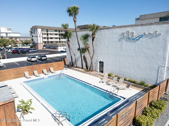 a view of a living room and kitchen