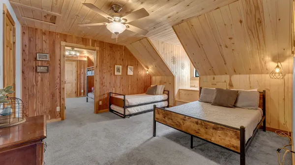 a bedroom with furniture and a chandelier