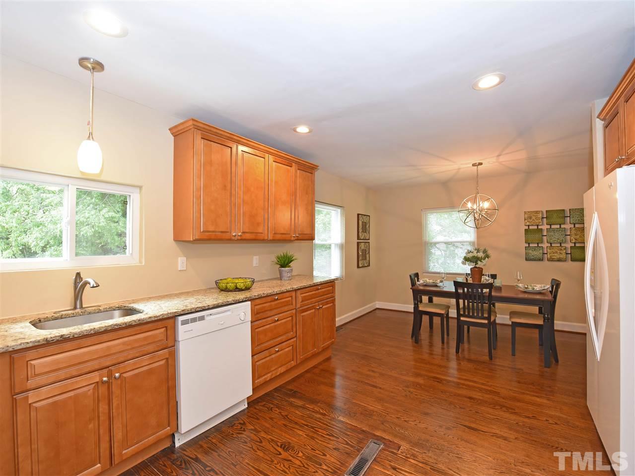 726 South State Street Raleigh, NC 27601 - Photo 11 of 25 a kitchen with lots of counter top space and dining table