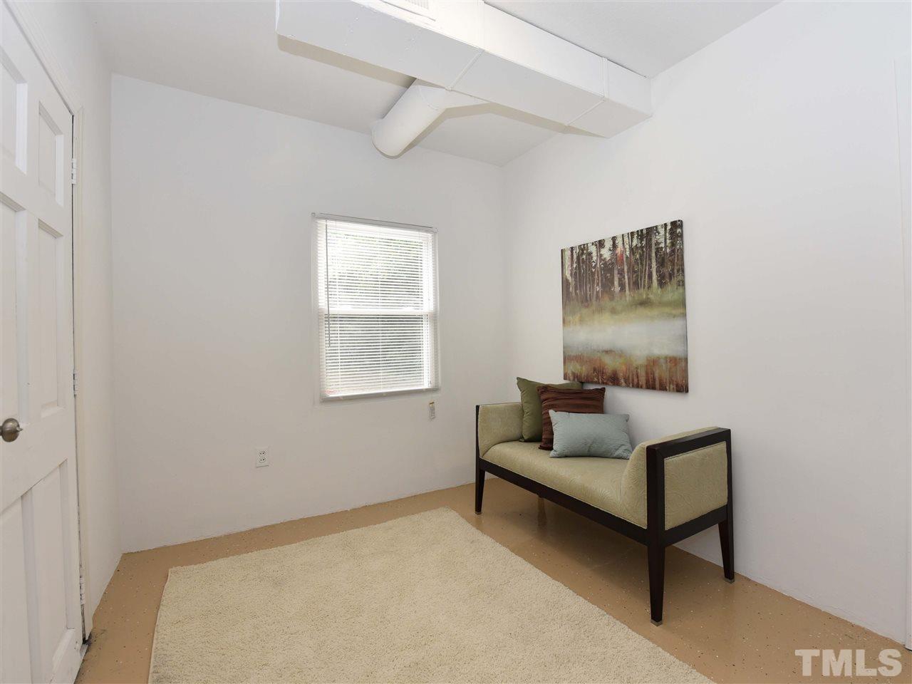 726 South State Street Raleigh, NC 27601 - Photo 16 of 25 a living room with furniture and a window