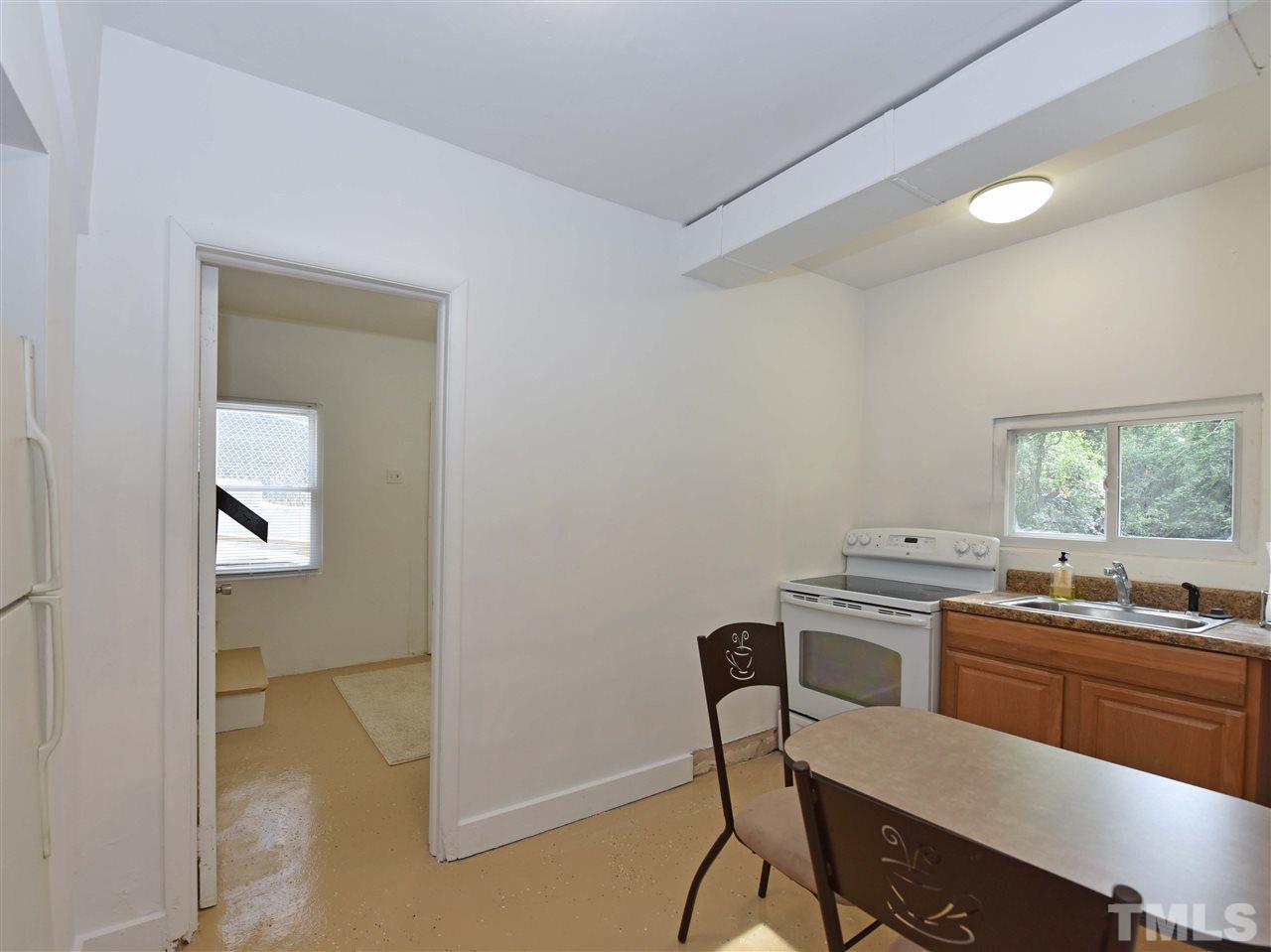 726 South State Street Raleigh, NC 27601 - Photo 18 of 25 a kitchen with a sink cabinets and window