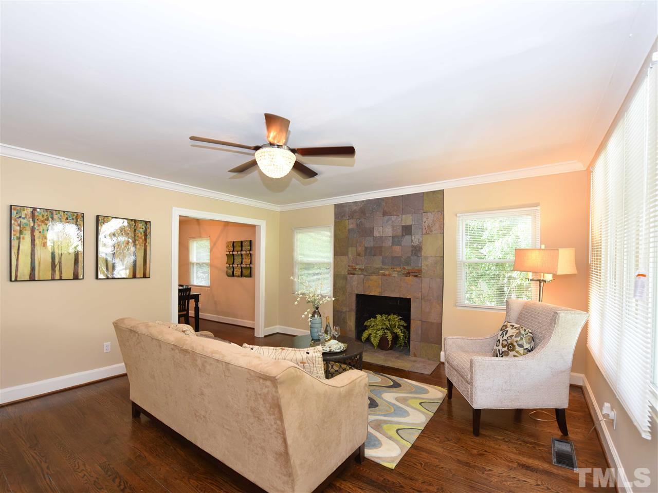 726 South State Street Raleigh, NC 27601 - Photo 5 of 25 a living room with furniture and a fireplace