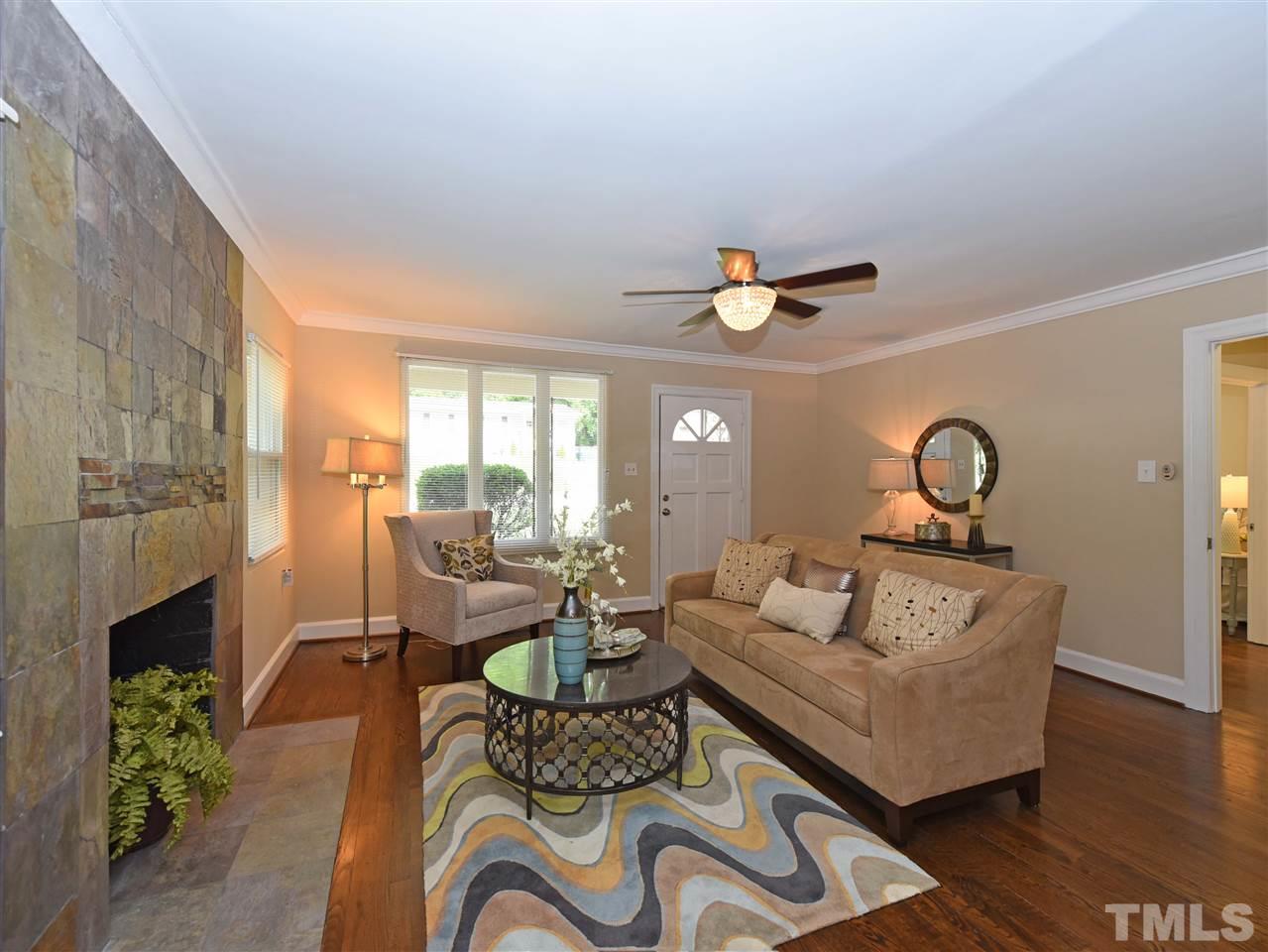 726 South State Street Raleigh, NC 27601 - Photo 6 of 25 a living room with furniture and a fireplace
