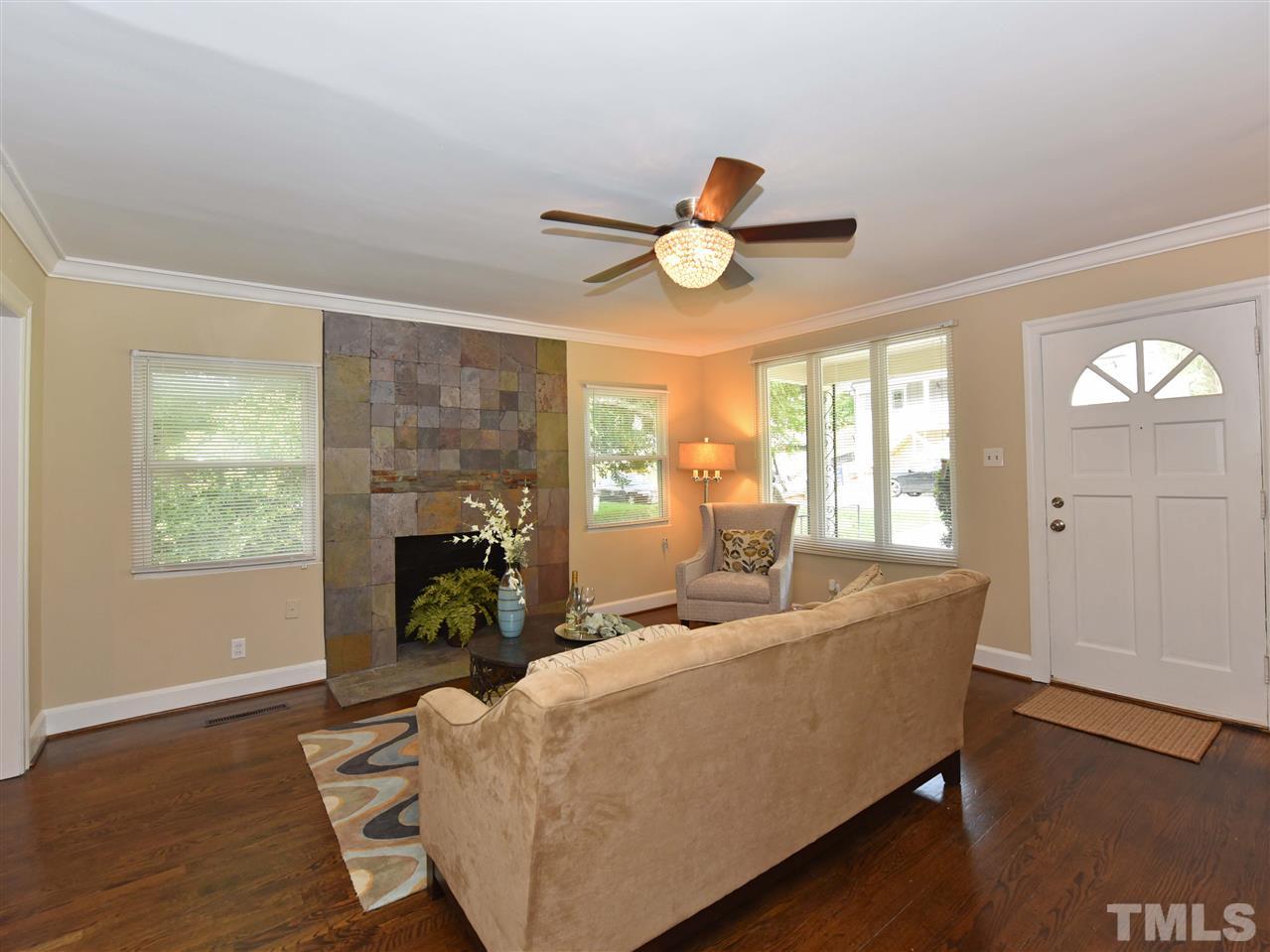 726 South State Street Raleigh, NC 27601 - Photo 7 of 25 a living room with furniture and a fireplace